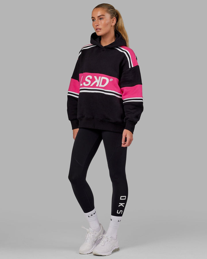 Woman wearing Unisex A-Team Hoodie Oversize - Black-Pink