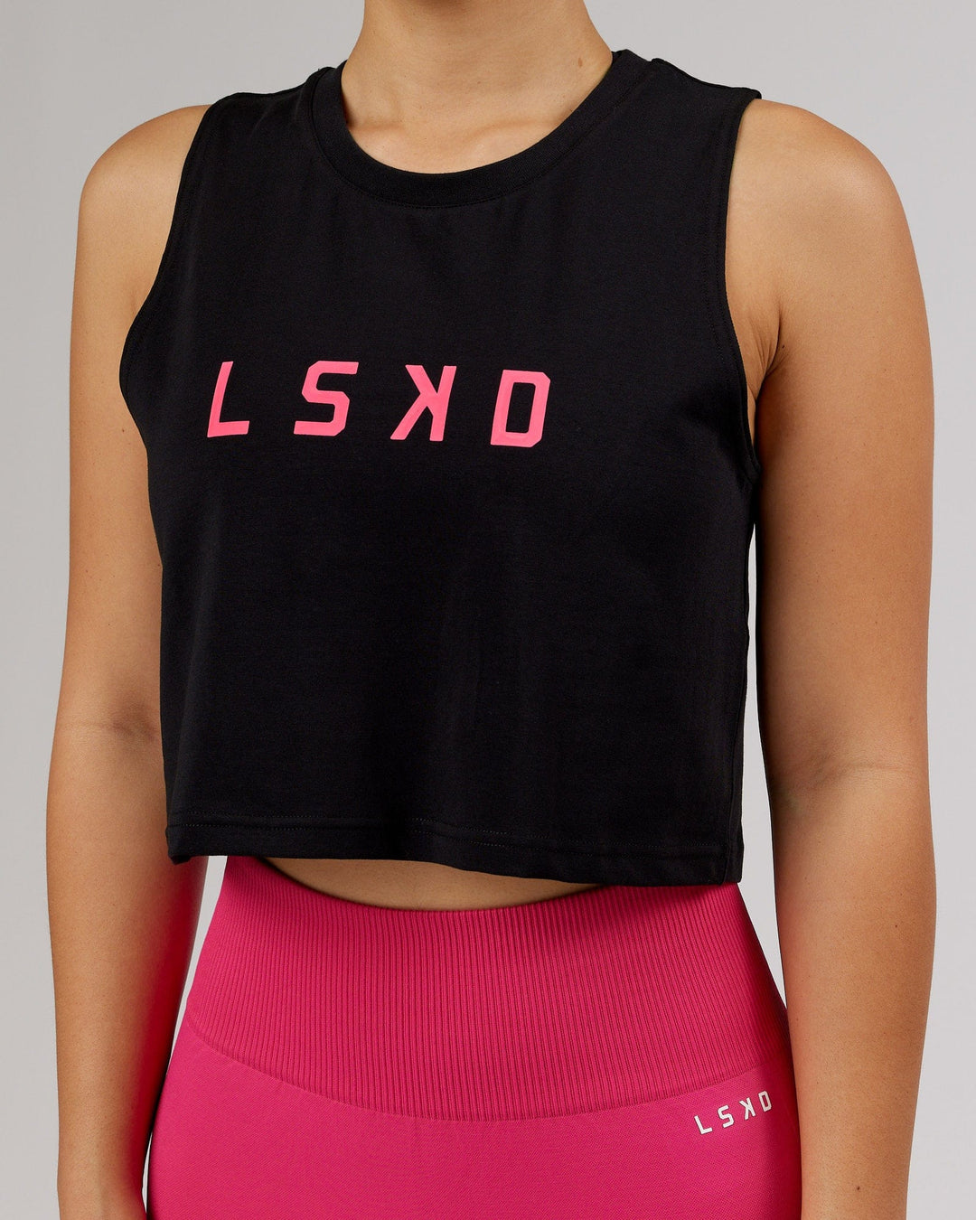 Woman wearing Agile FLXCotton Tank - Black-Boysenberry