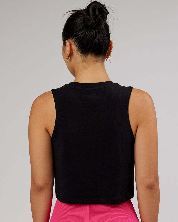 Woman wearing Agile FLXCotton Tank - Black-Magenta
