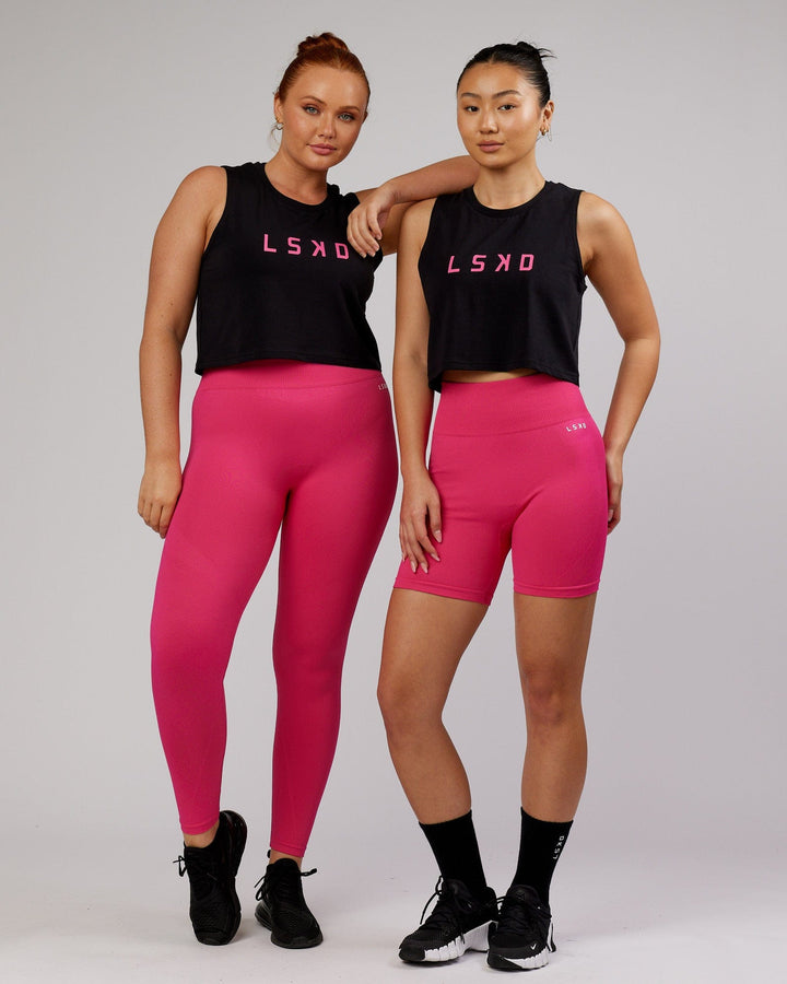 Woman wearing Agile FLXCotton Tank - Black-Magenta