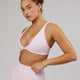 Woman wearing Agile Sports Bra - Blush Leopard