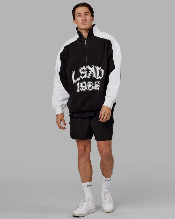 Man wearing Unisex Alumni 1/4 Zip Sweater Oversize - Black-White