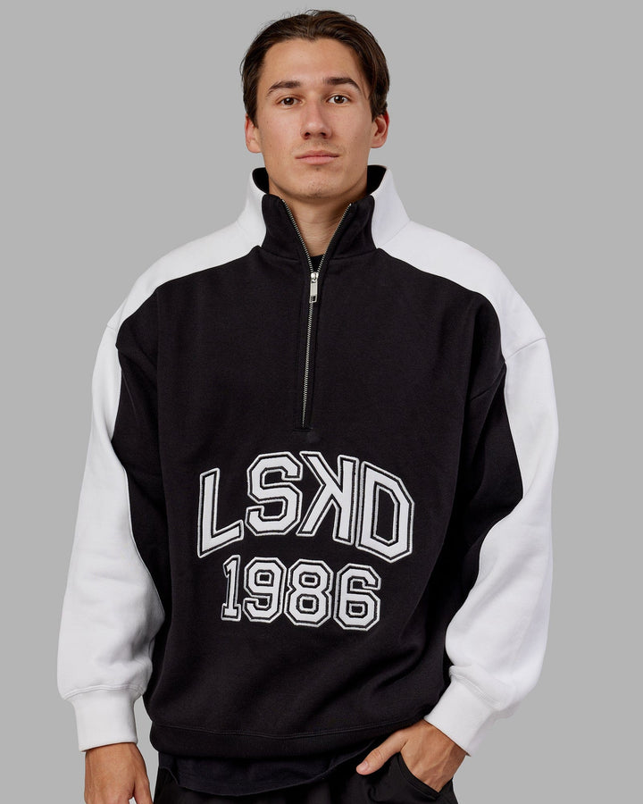Man wearing Unisex Alumni 1/4 Zip Sweater Oversize - Black-White