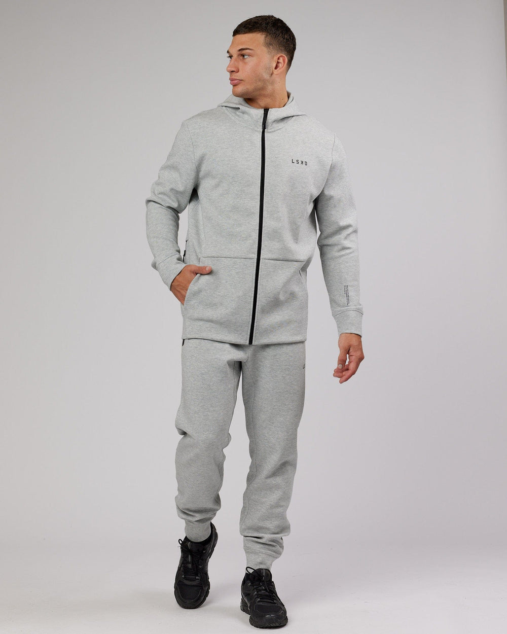 Man wearing Athlete ForgedFleece Zip Up Hoodie - Lt Grey Marl