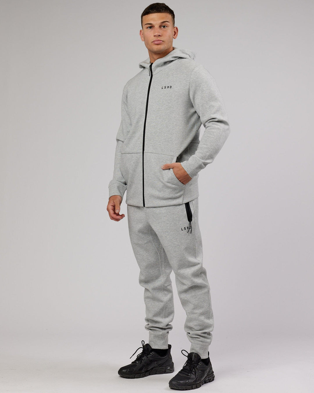 Man wearing Athlete ForgedFleece Zip Up Hoodie - Lt Grey Marl