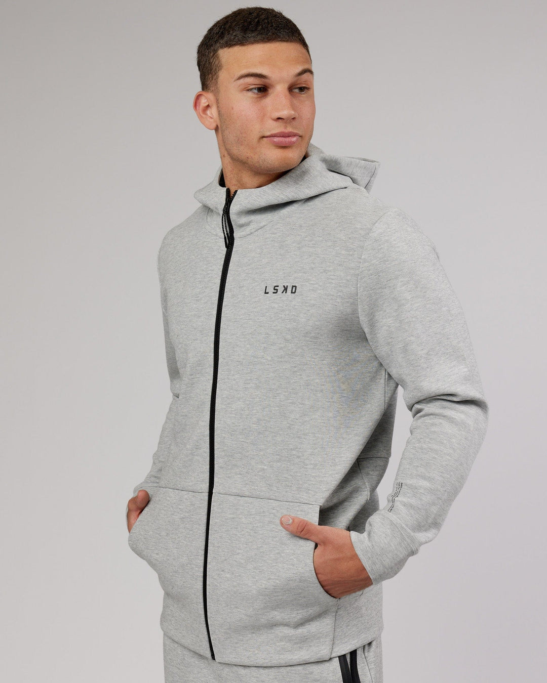 Man wearing Athlete ForgedFleece Zip Up Hoodie - Lt Grey Marl