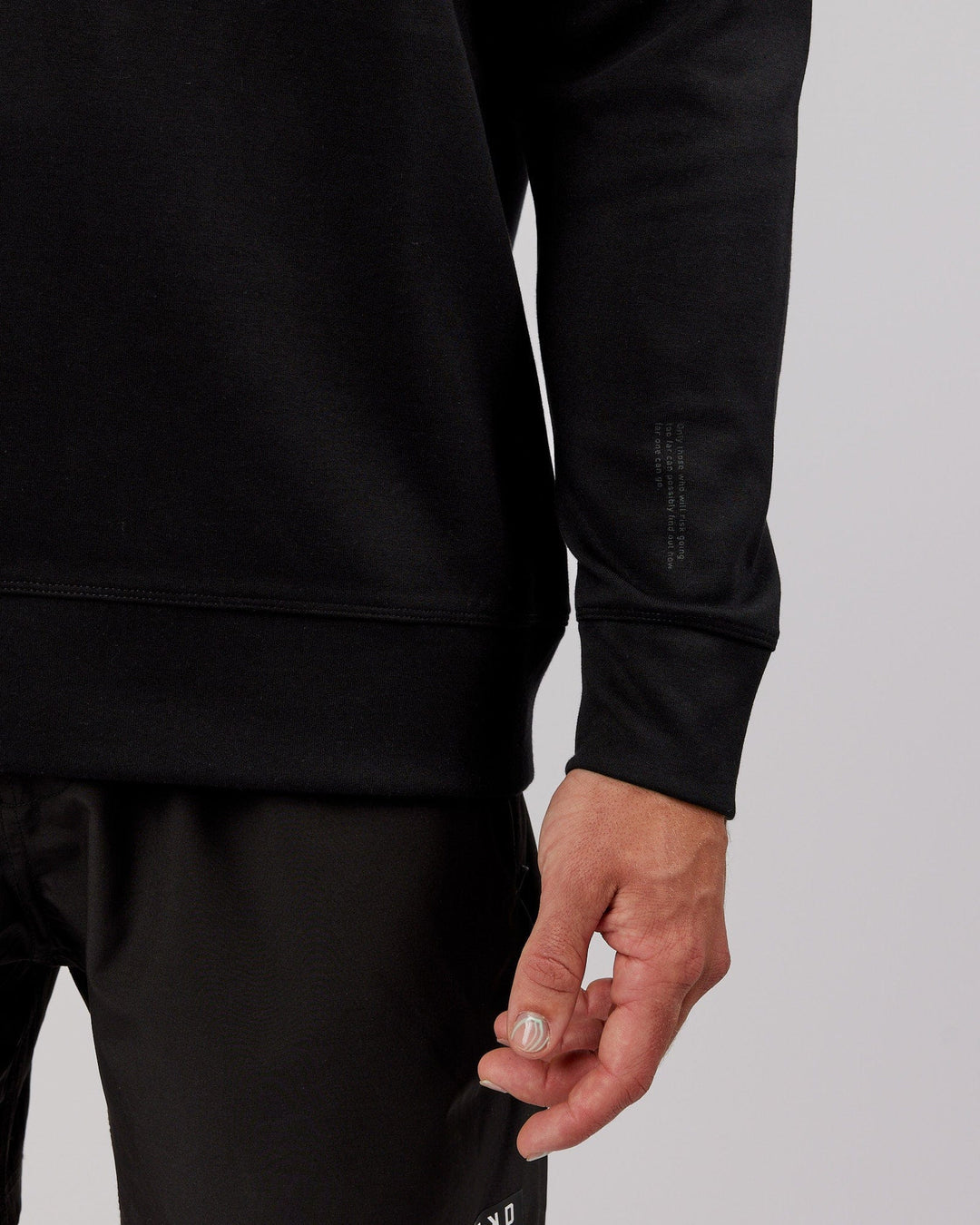 Man wearing Athlete ForgedFleece Sweater - Black