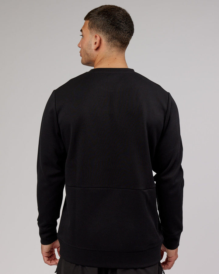 Man wearing Athlete ForgedFleece Sweater - Black