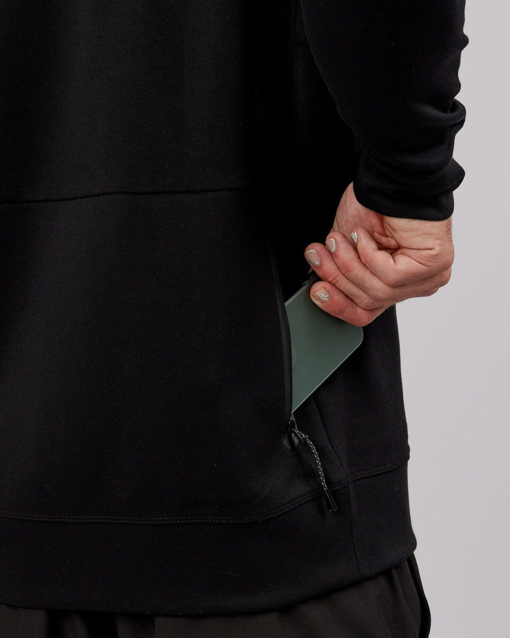 Man wearing Athlete ForgedFleece Sweater - Black