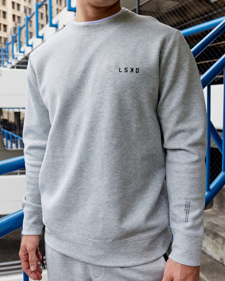 Man wearing Athlete ForgedFleece Sweater - Lt Grey Marl