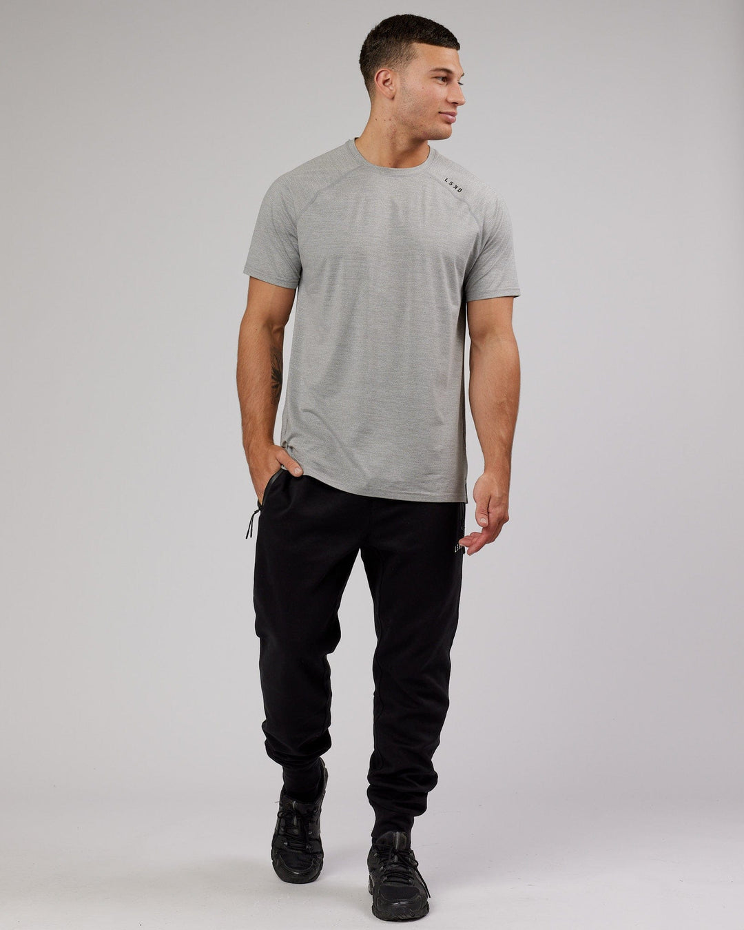 Man wearing Athlete ForgedFleece Zip Trackpant - Black