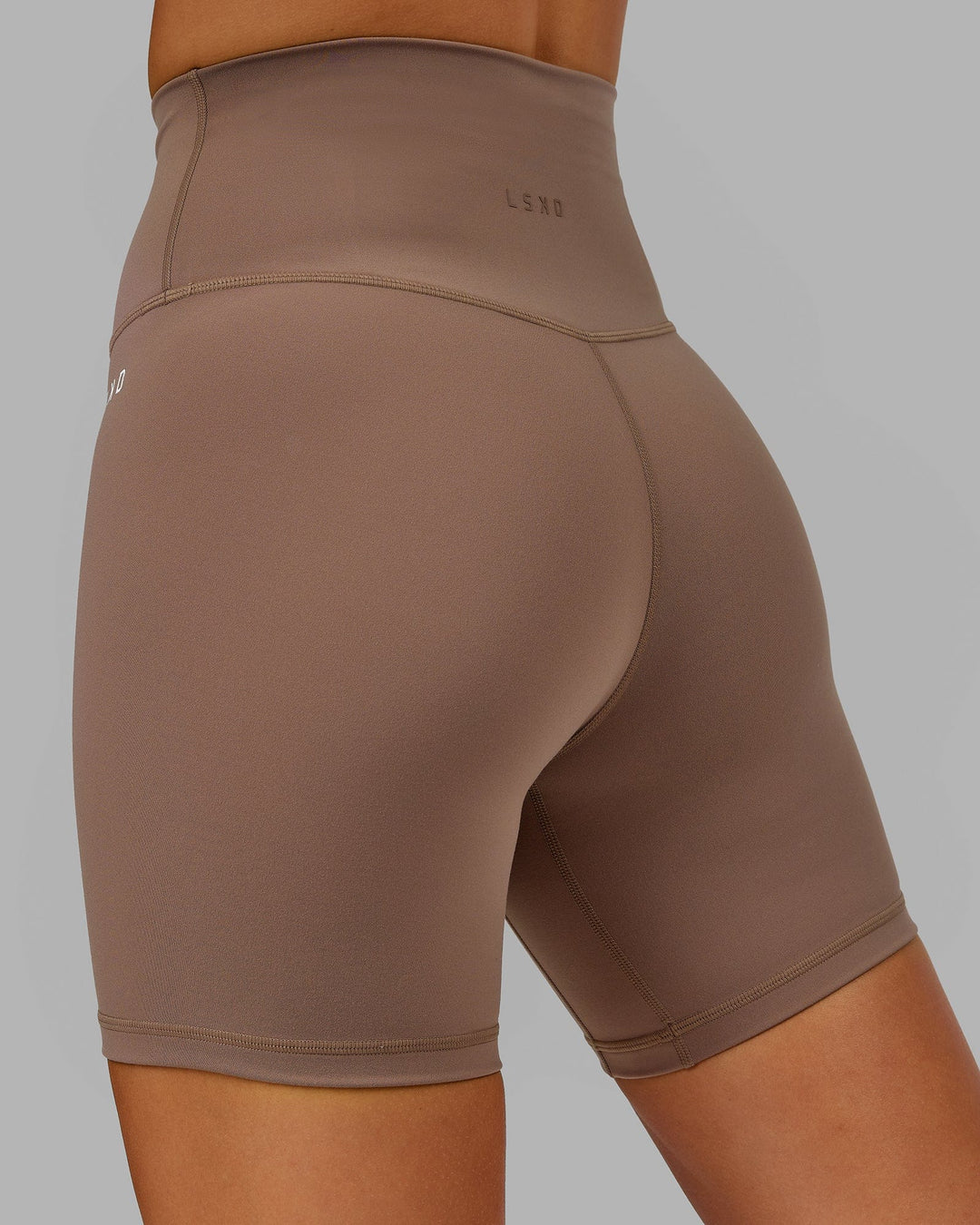 Woman wearing Base 2.0 Mid Short Tight - Deep Taupe