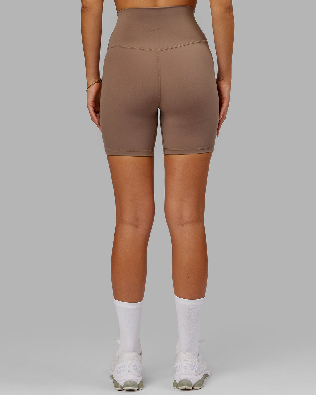 Woman wearing Base 2.0 Mid Short Tight - Deep Taupe