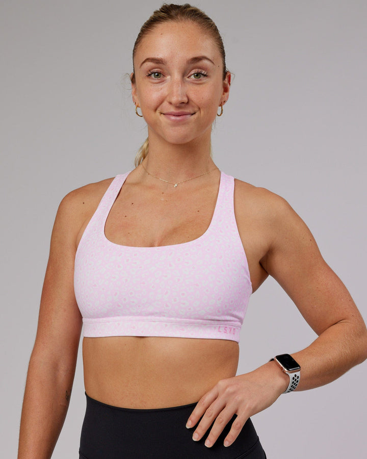 Woman wearing Base Sports Bra - Blush Leopard