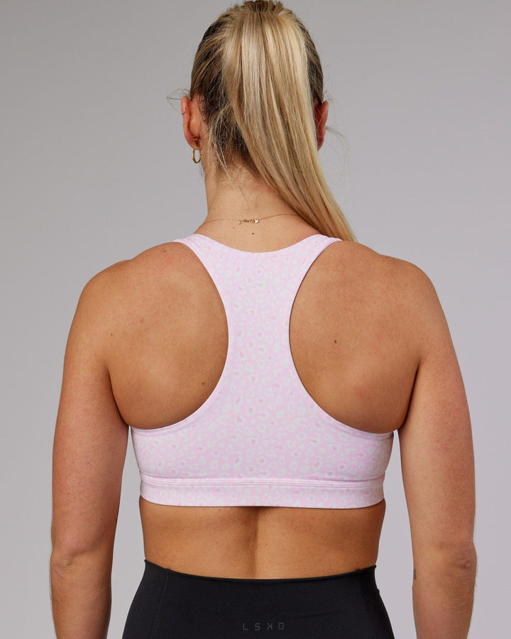 Woman wearing Base Sports Bra - Blush Leopard