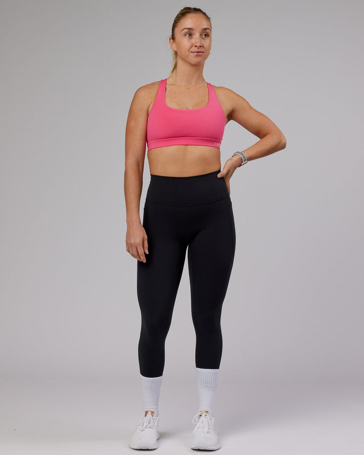 Woman wearing Base Sports Bra - Flamingo