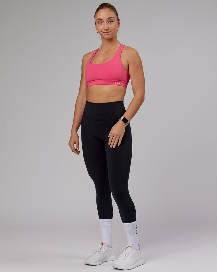 Woman wearing Base Sports Bra - Flamingo