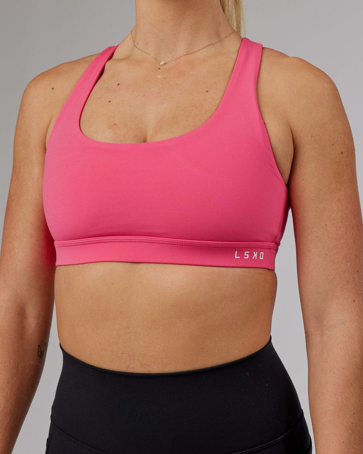 Woman wearing Base Sports Bra - Flamingo