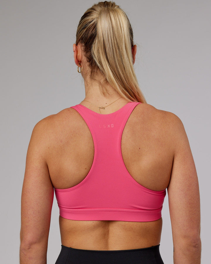 Woman wearing Base Sports Bra - Flamingo