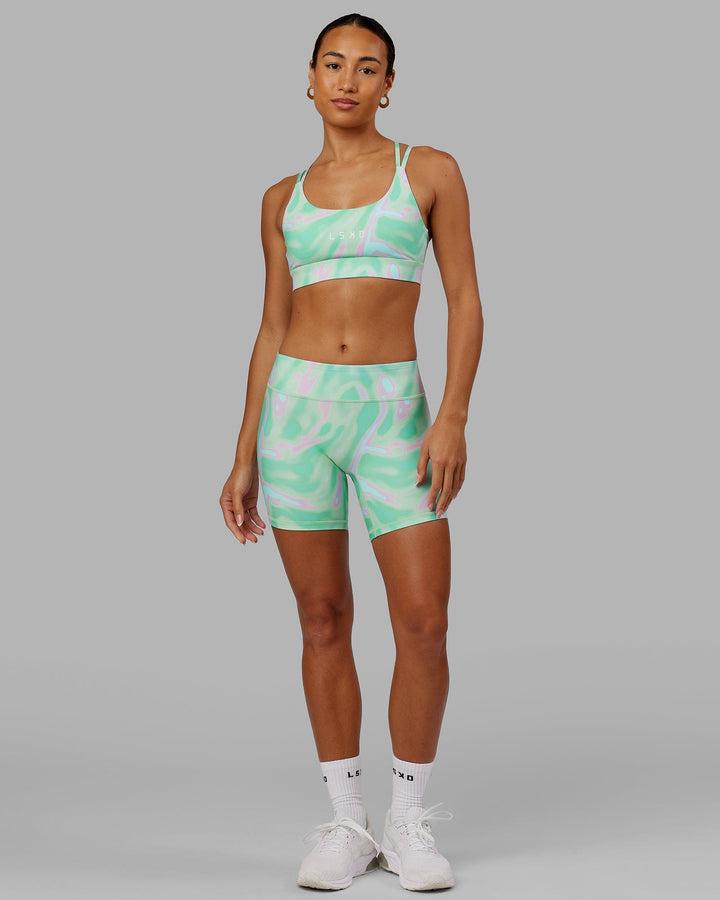 Woman wearing Bridge Sports Bra - Euphoria Teal