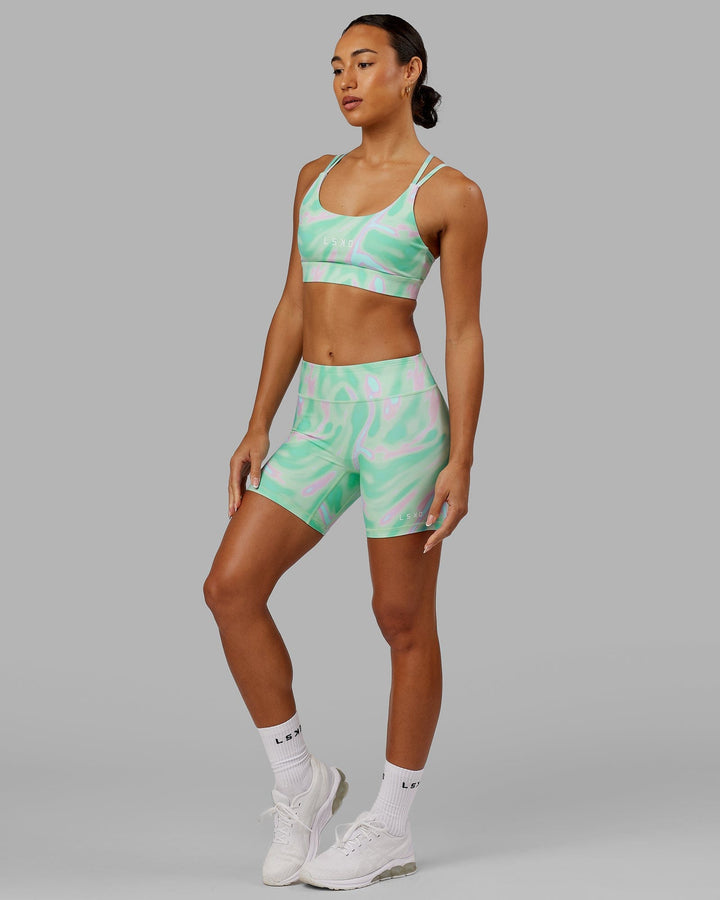 Woman wearing Bridge Sports Bra - Euphoria Teal