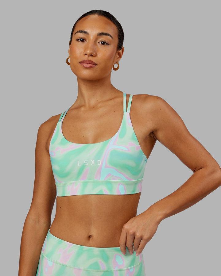 Woman wearing Bridge Sports Bra - Euphoria Teal