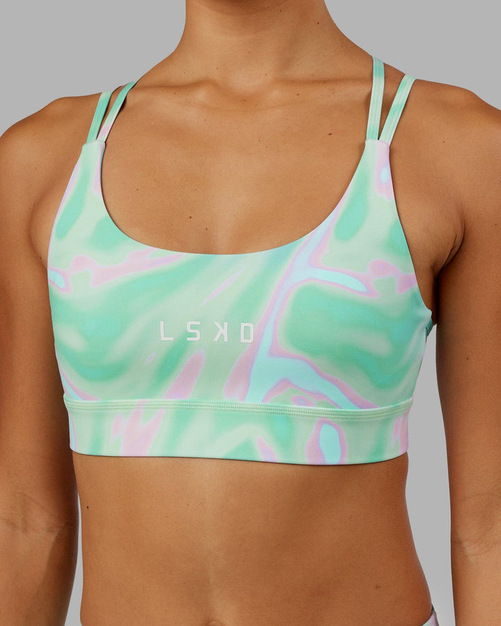 Woman wearing Bridge Sports Bra - Euphoria Teal