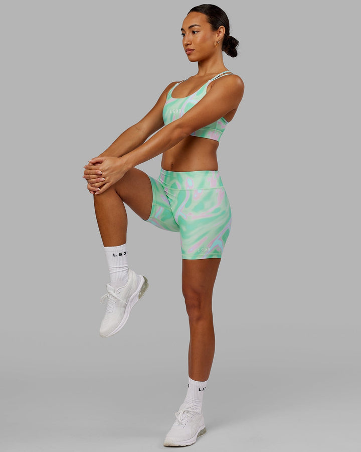Woman wearing Bridge Sports Bra - Euphoria Teal
