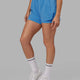 Woman wearing Challenger Liner Run Short - Azure Blue