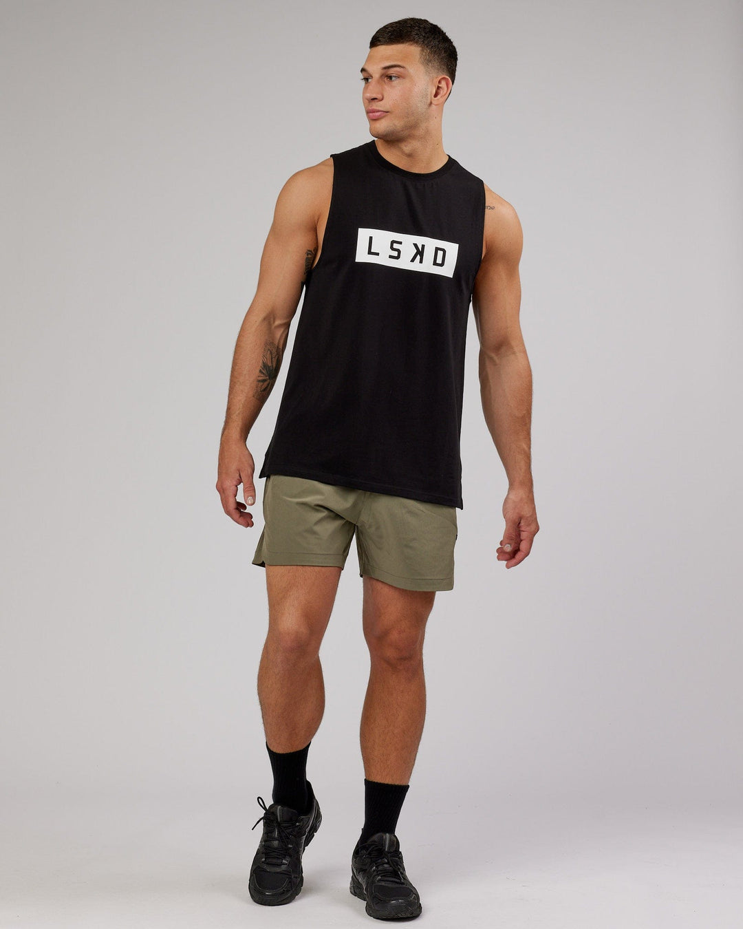 Man wearing Competition 5" Performance Short - Olive Fade