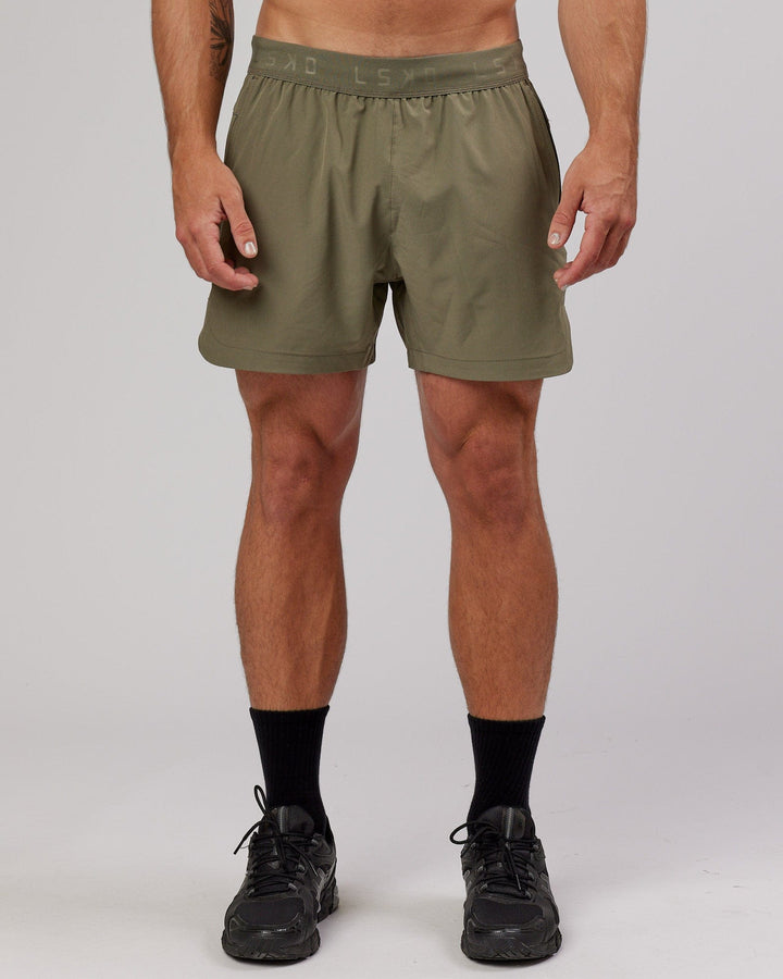 Man wearing Competition 5" Performance Short - Olive Fade