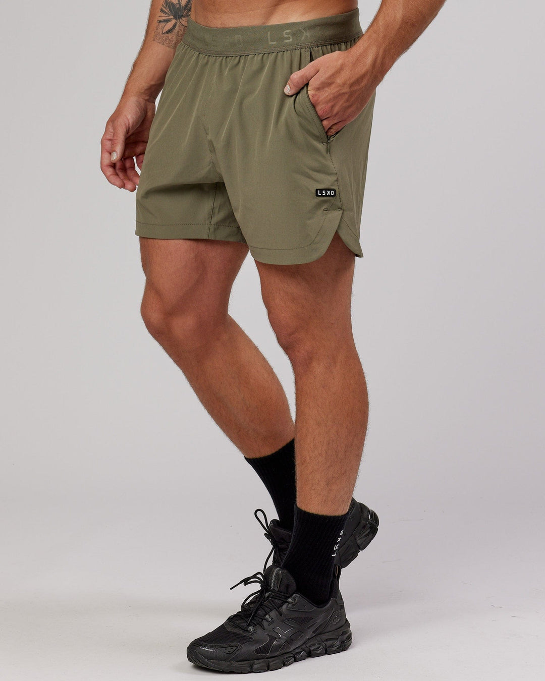 Man wearing Competition 5" Performance Short - Olive Fade