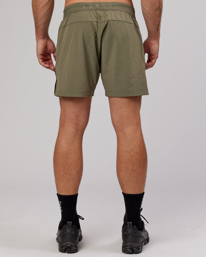 Man wearing Competition 5" Performance Short - Olive Fade