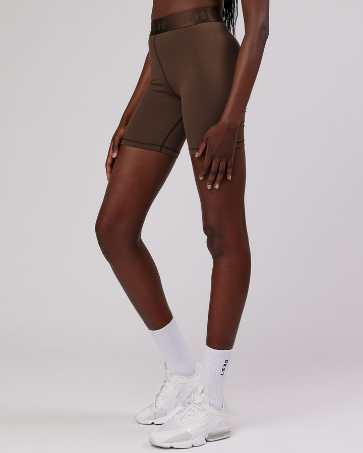 Woman wearing Competition Mid Short Tight - Walnut