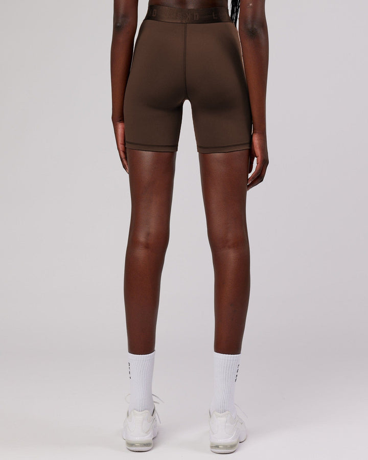 Woman wearing Competition Mid Short Tight - Walnut