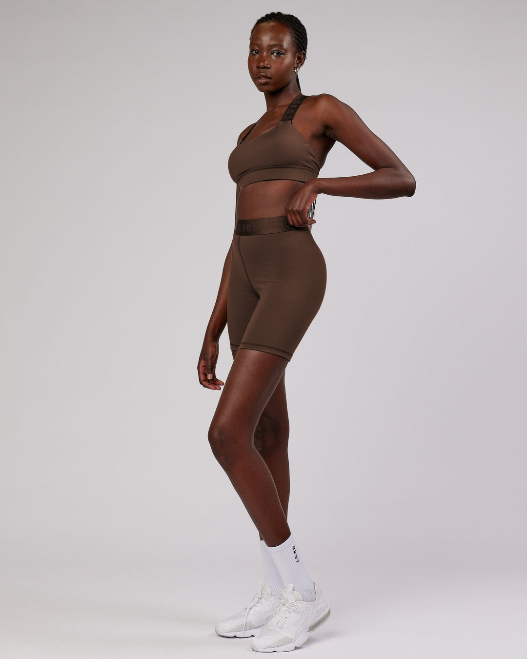 Woman wearing Competition Mid Short Tight - Walnut