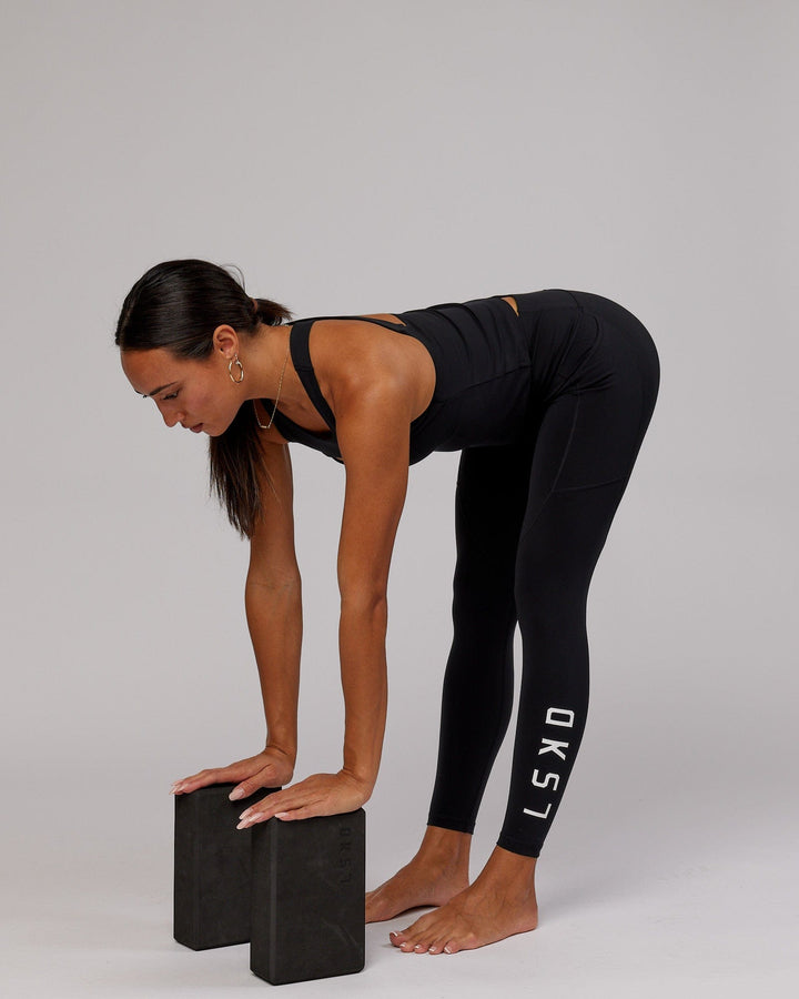 Woman wearing Driven Shelf Bra Performance Tank - Black