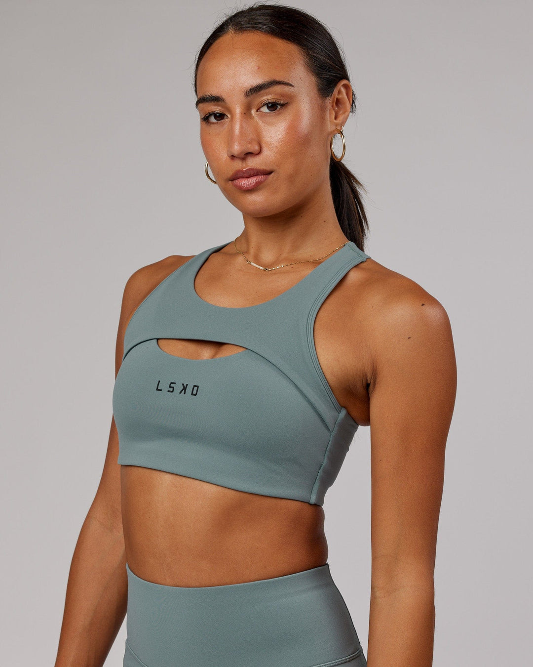 Woman wearing Driven Sports Bra - Eclipse