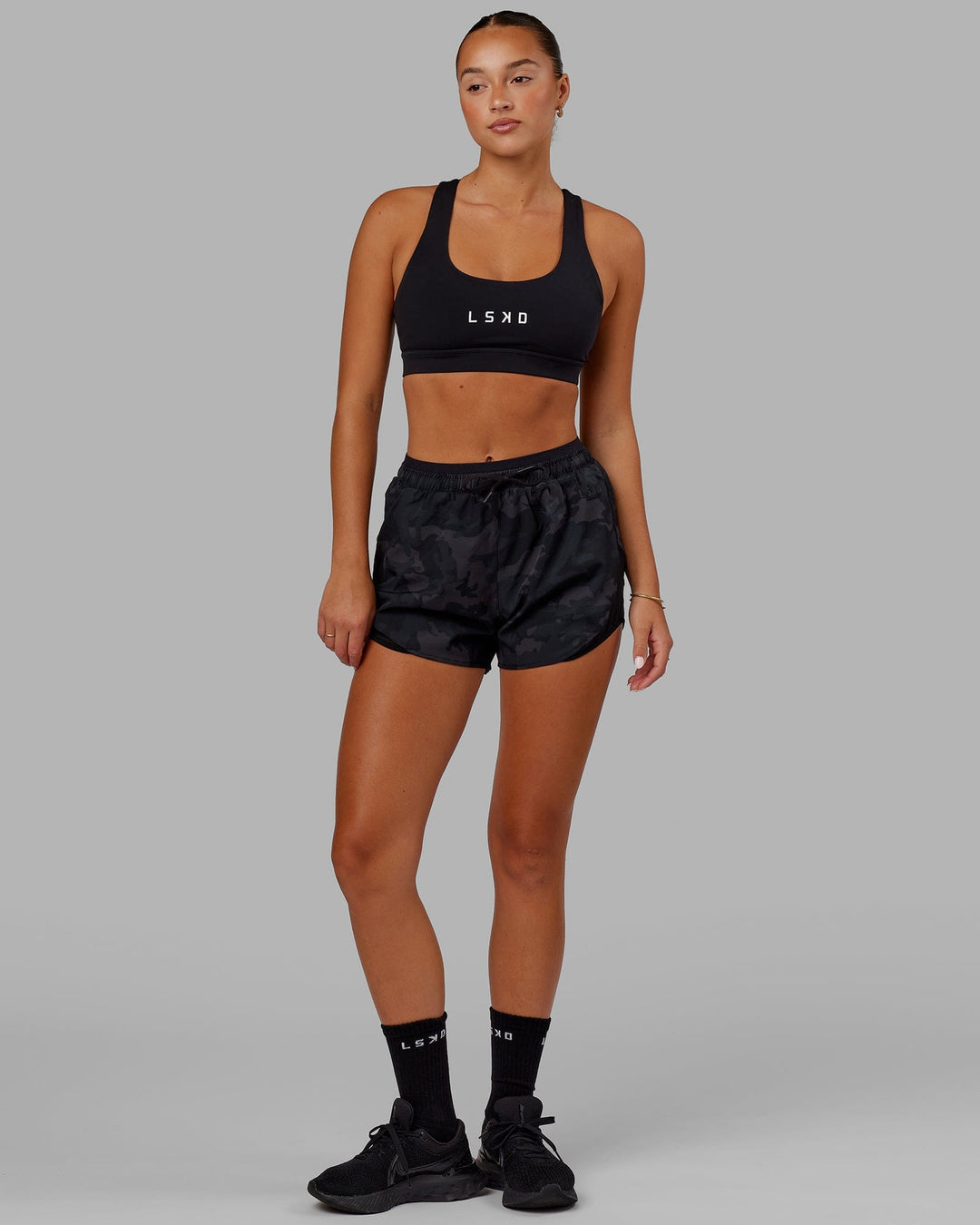 Woman wearing Social Run Short - Black Camo