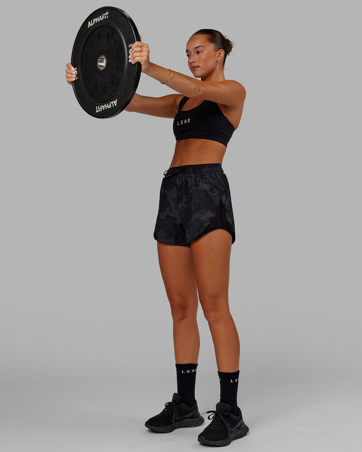 Woman wearing Social Run Short - Black Camo