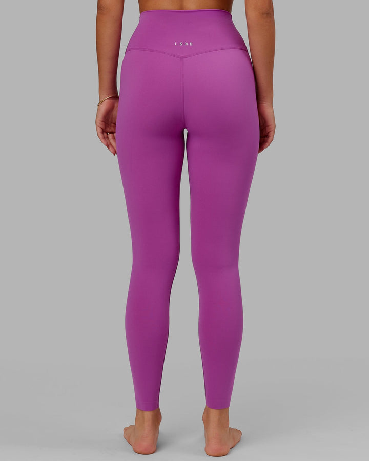 Woman wearing Elixir Full Length Tight - Orchid