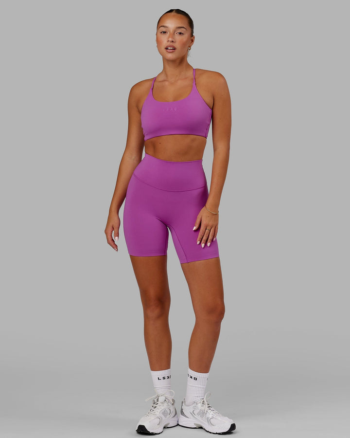 Woman wearing Elixir Mid Short Tight - Orchid
