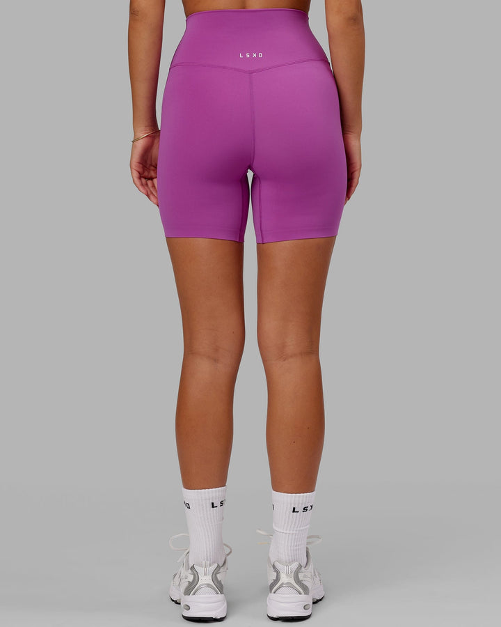 Woman wearing Elixir Mid Short Tight - Orchid