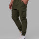 Man wearing Energy Stretch Performance Cargo Joggers - Forest Night