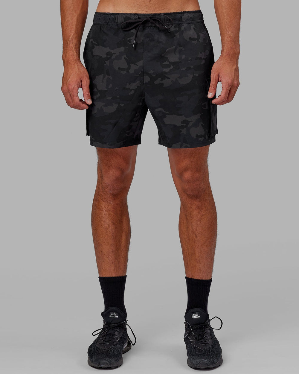 Man wearing Energy Stretch Performance Cargo Short - Black Camo
