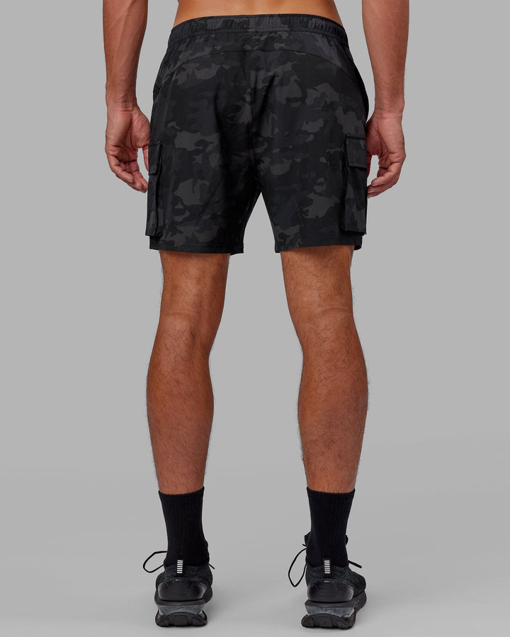 Man wearing Energy Stretch Performance Cargo Short - Black Camo