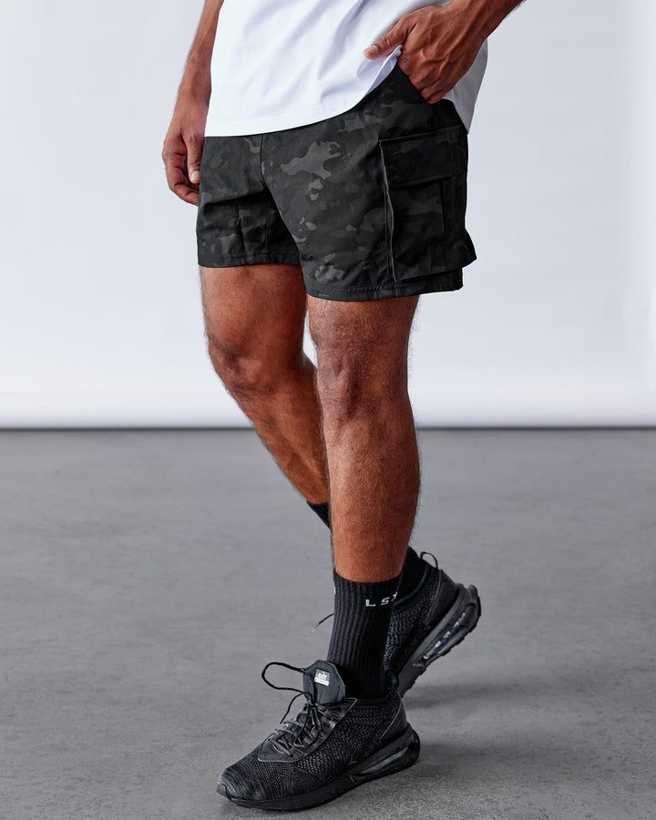 Man Wearing Energy Stretch Performance Cargo Short - Black Camo