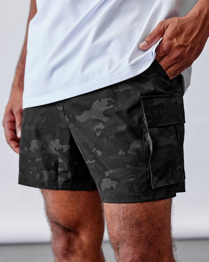 Man Wearing Energy Stretch Performance Cargo Short - Black Camo
