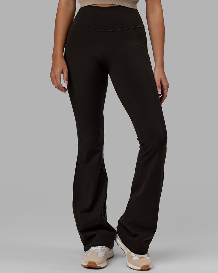 Woman wearing Everyday Flare Leggings - Dark Walnut