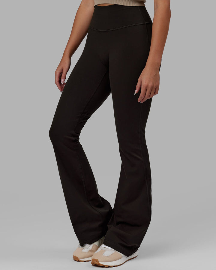Woman wearing Everyday Flare Leggings - Dark Walnut